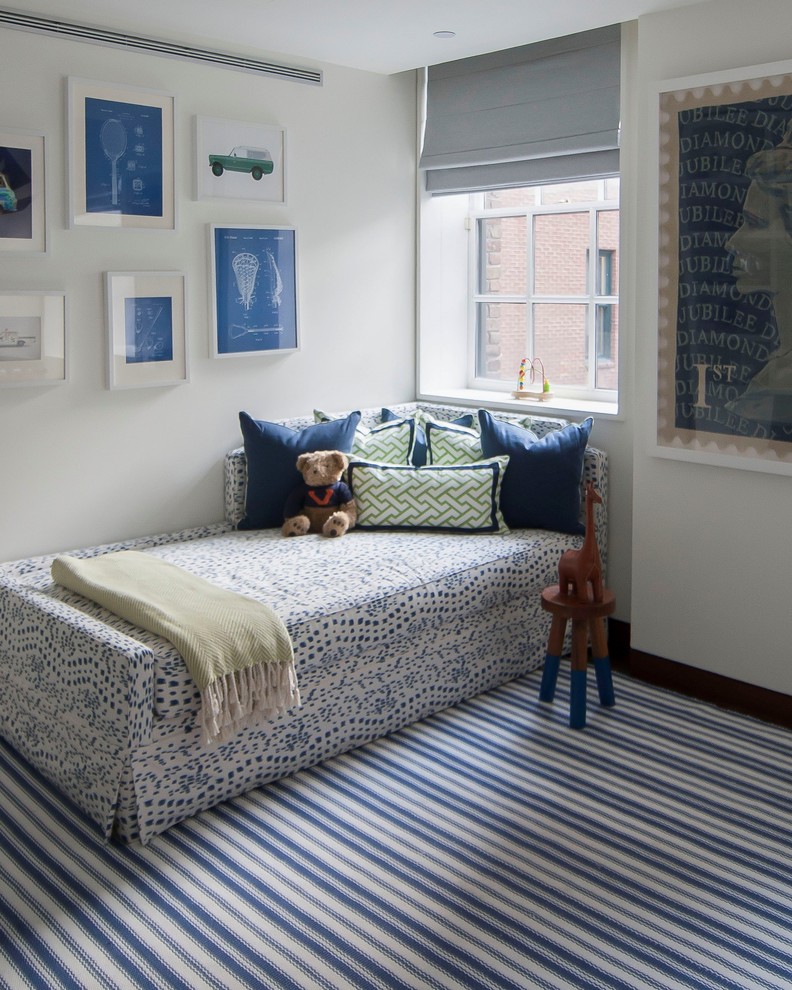 Design ideas for a classic gender neutral children’s room in New York with white walls and carpet.