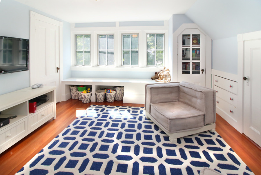 Playroom - mid-sized traditional gender-neutral medium tone wood floor playroom idea in Boston with blue walls