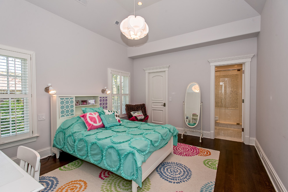 Photo of an eclectic teen’s room for girls in Chicago with grey walls and dark hardwood flooring.