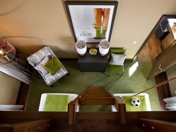 Photo of a medium sized traditional children’s room for boys in Atlanta with beige walls, carpet and green floors.