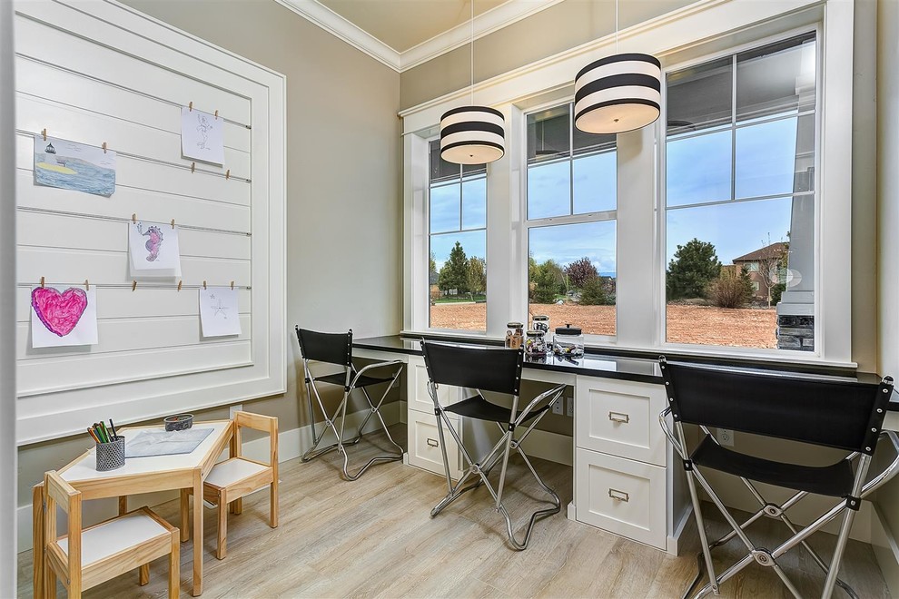 Inspiration for a large traditional gender neutral kids' study space in Boise with beige walls, light hardwood flooring and beige floors.