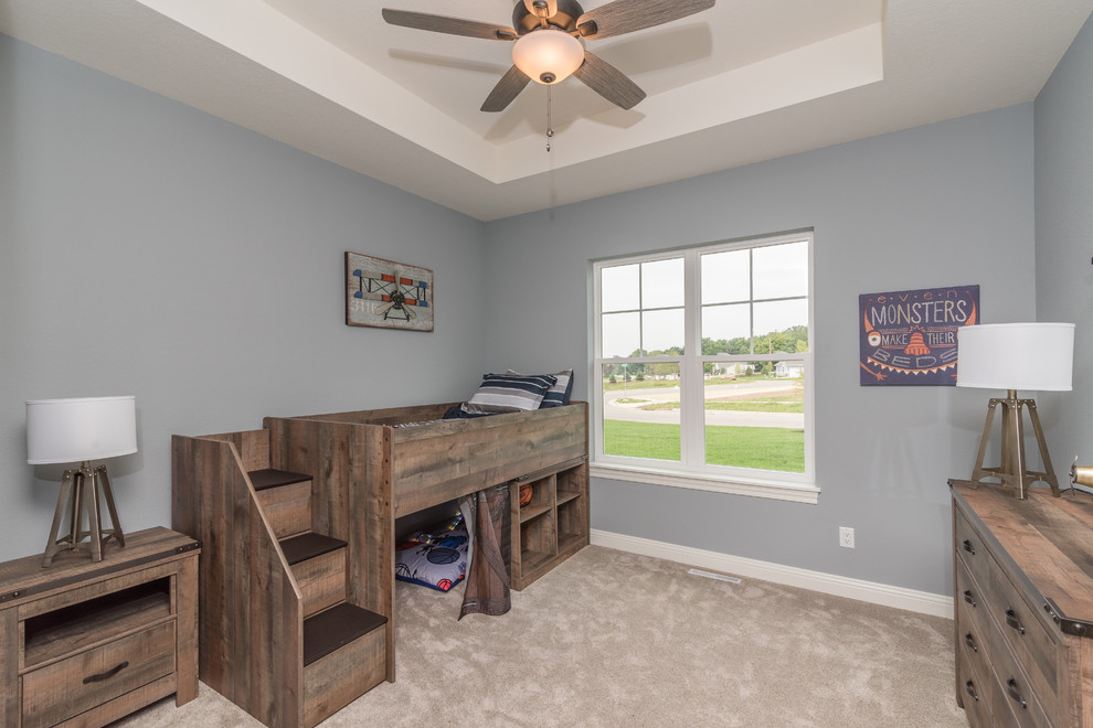 Medium sized rustic children’s room for boys in Milwaukee with blue walls, carpet and beige floors.