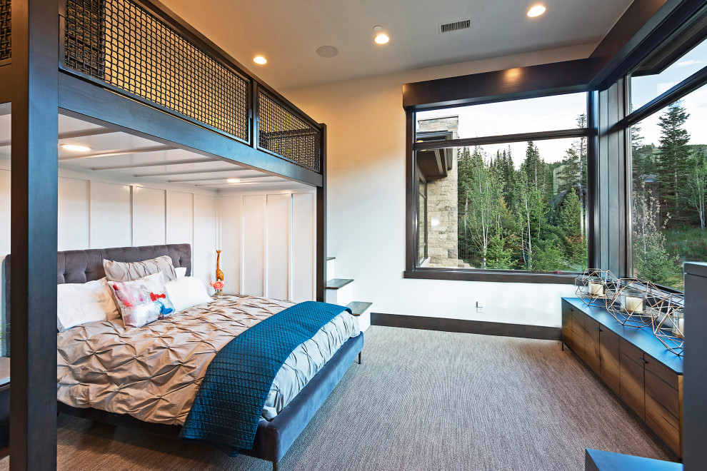 This is an example of a rustic gender neutral kids' bedroom in Salt Lake City with white walls, carpet and grey floors.