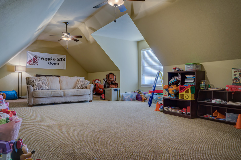 Design ideas for an expansive traditional gender neutral kids' bedroom in Austin with beige walls and carpet.
