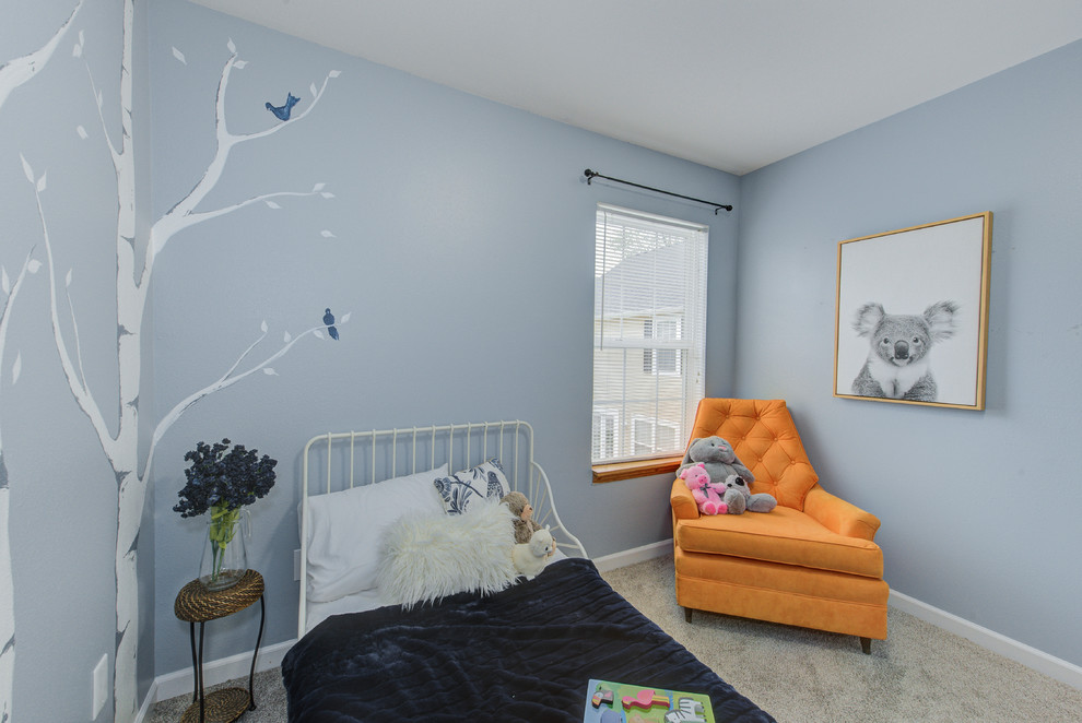Example of a small gender-neutral brown floor and carpeted kids' room design in Indianapolis with blue walls