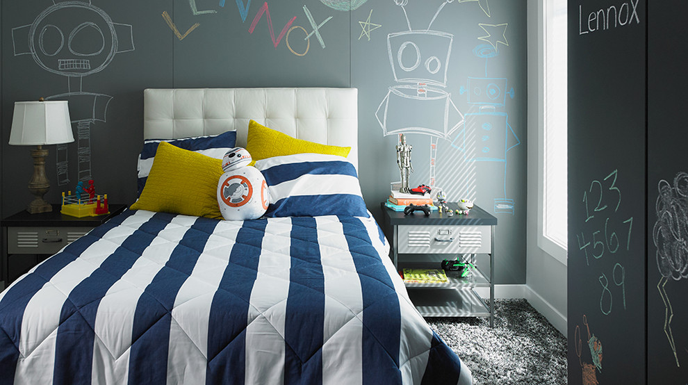 This is an example of a contemporary children’s room for boys in Cincinnati with grey walls and carpet.