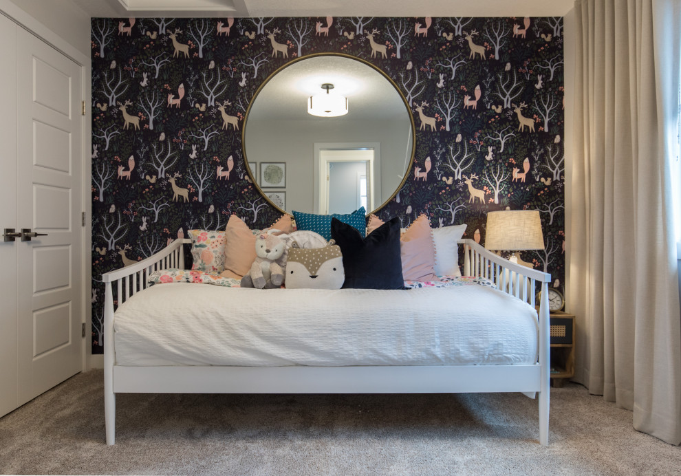 Small country children’s room for girls in Calgary with multi-coloured walls, carpet, grey floors and wallpapered walls.