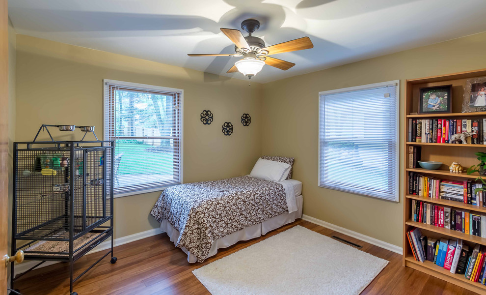 Mid-sized transitional gender-neutral light wood floor, brown floor, wallpaper ceiling and wallpaper kids' room photo in Chicago with yellow walls