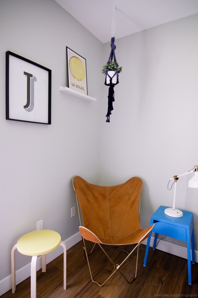 Inspiration for a medium sized bohemian toddler’s room for boys in Orange County with grey walls and dark hardwood flooring.