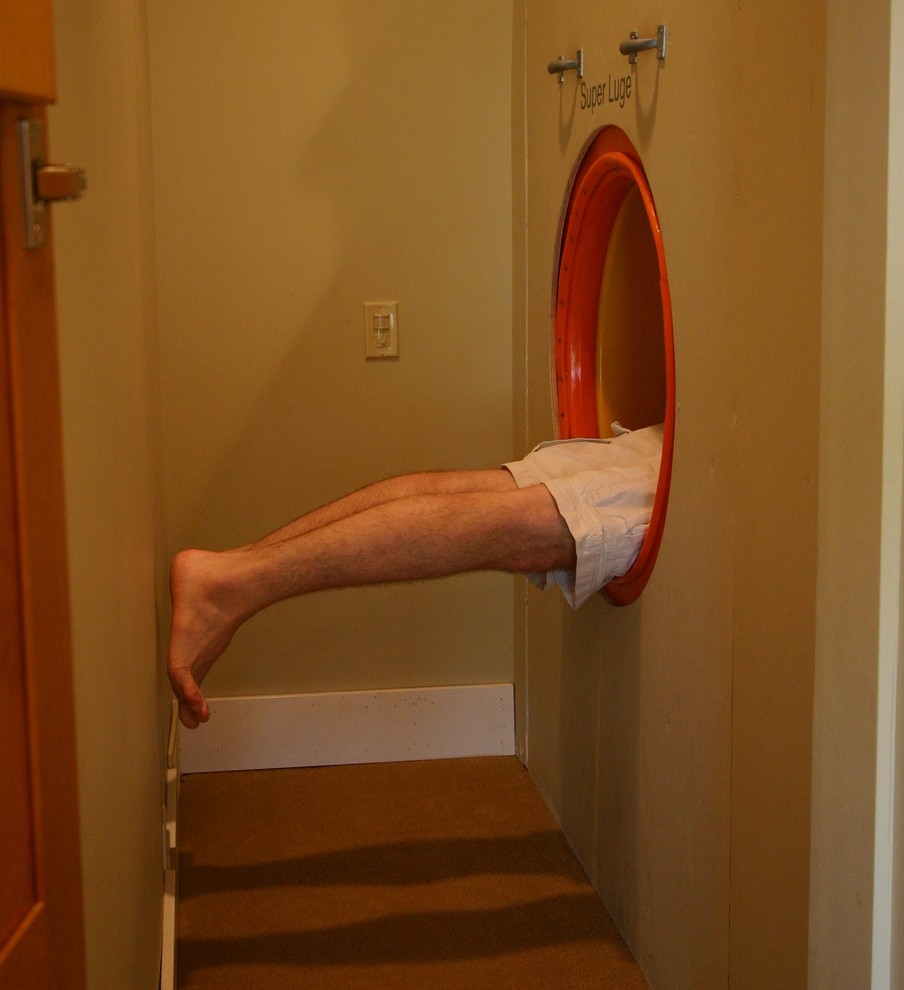 Trendy gender-neutral kids' room photo in Minneapolis with beige walls
