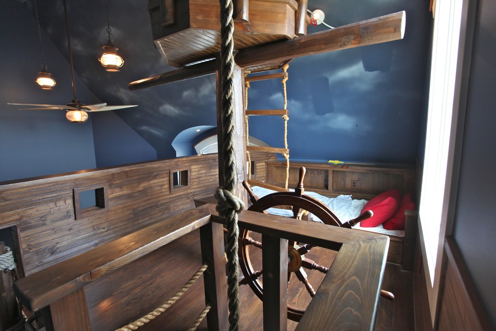 Пример оригинального дизайна: нейтральная детская в современном стиле с спальным местом, синими стенами и ковровым покрытием для ребенка от 4 до 10 лет