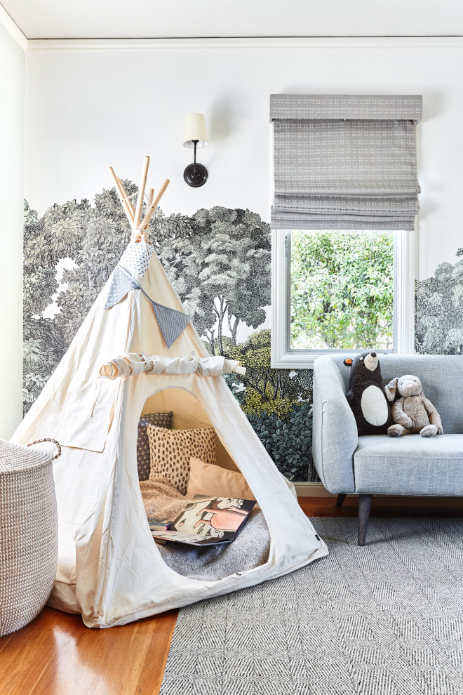 Large eclectic kids' bedroom for boys in San Francisco with grey walls, light hardwood flooring and wallpapered walls.