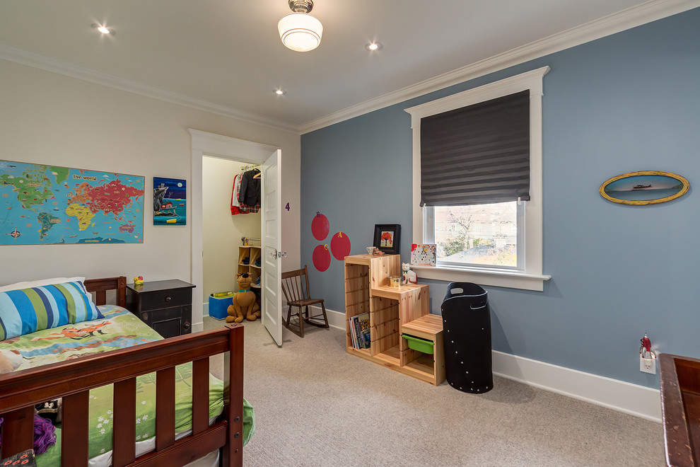 This is an example of a medium sized classic kids' bedroom in Calgary with blue walls and carpet.