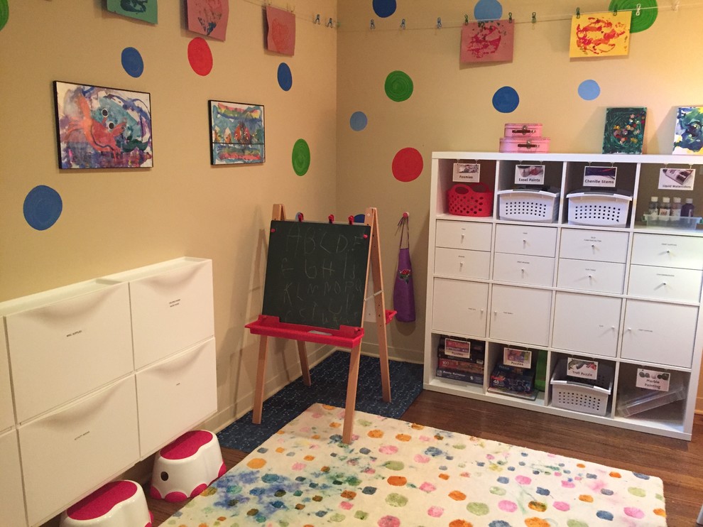 Example of a large transitional gender-neutral medium tone wood floor and brown floor kids' room design in New York with brown walls