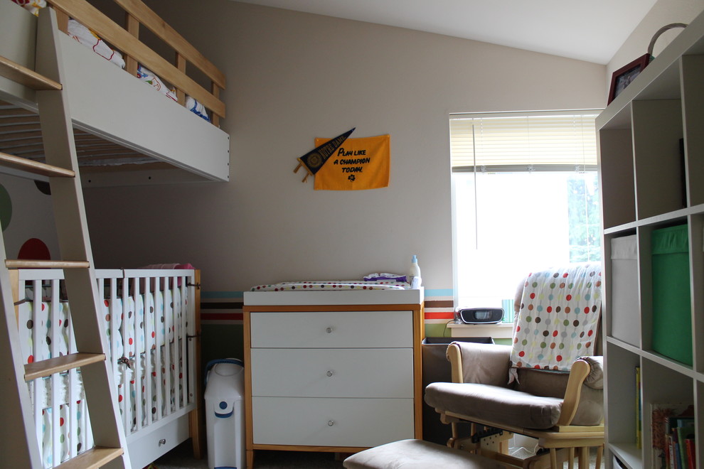 Inspiration for a small contemporary gender neutral toddler’s room in Seattle with carpet.
