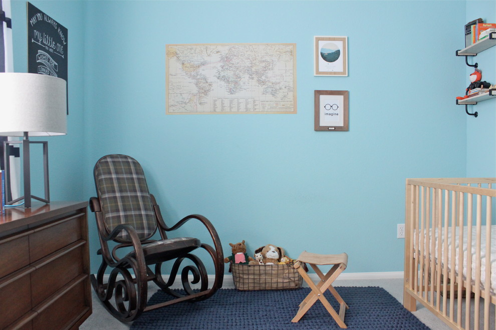 Photo of a medium sized midcentury toddler’s room for boys in Los Angeles with blue walls and carpet.