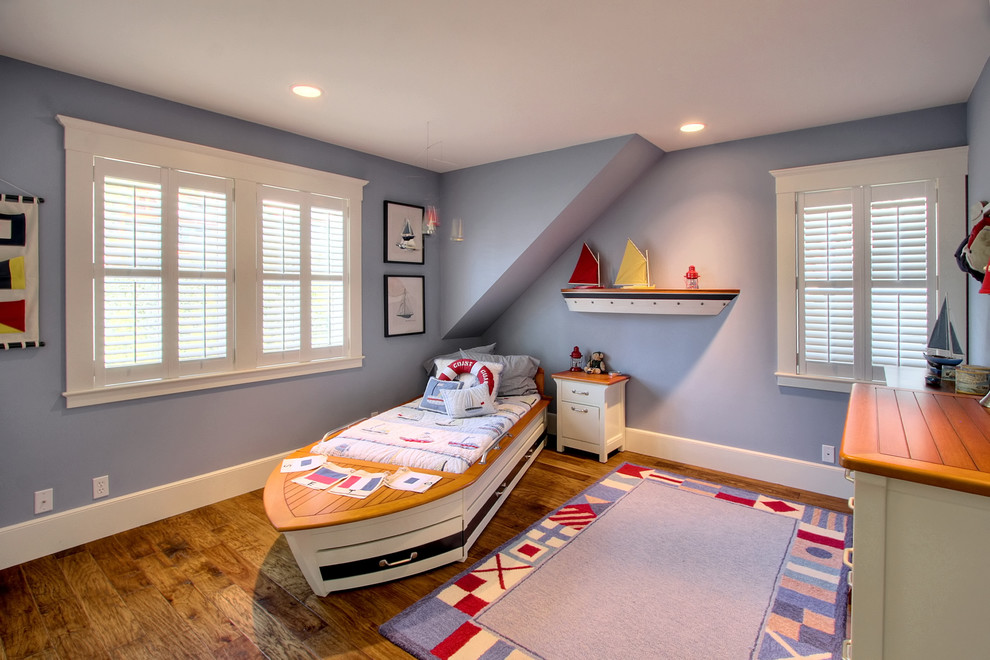 Inspiration for a medium sized nautical toddler’s room for boys in Seattle with medium hardwood flooring and purple walls.