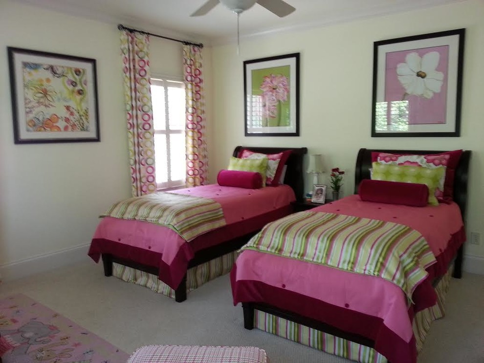 Medium sized modern children’s room for girls in Atlanta with yellow walls, carpet and beige floors.