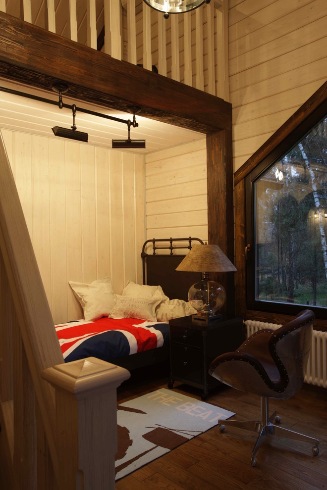 Inspiration pour une chambre d'enfant chalet de taille moyenne avec un mur blanc et un sol en bois brun.