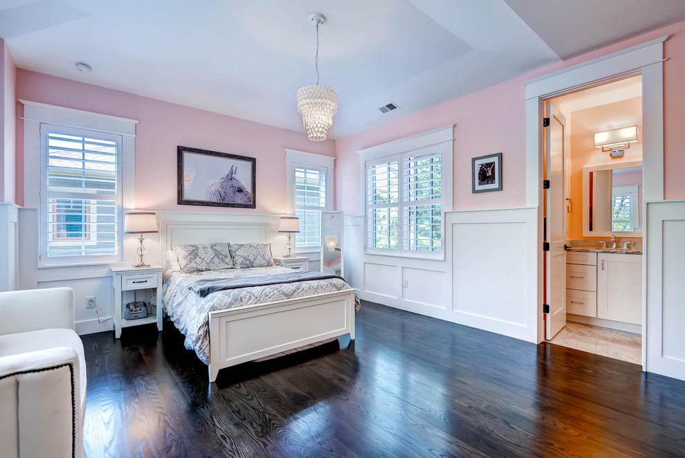 Large classic teen’s room for girls in Cedar Rapids with pink walls, dark hardwood flooring and brown floors.