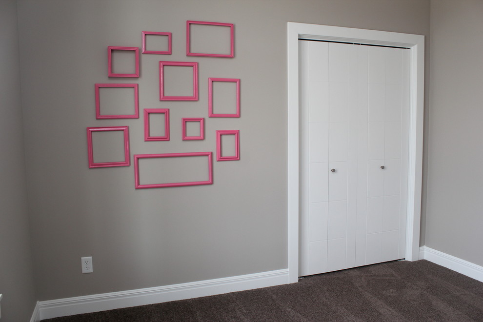 Example of a mid-sized transitional girl carpeted kids' room design in Wichita with gray walls