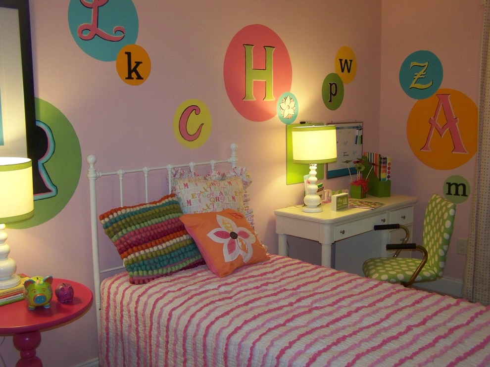 Photo of a contemporary kids' bedroom for girls in Indianapolis with multi-coloured walls.