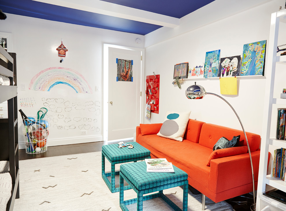 Example of a mid-sized transitional gender-neutral carpeted and white floor kids' room design in New York with white walls
