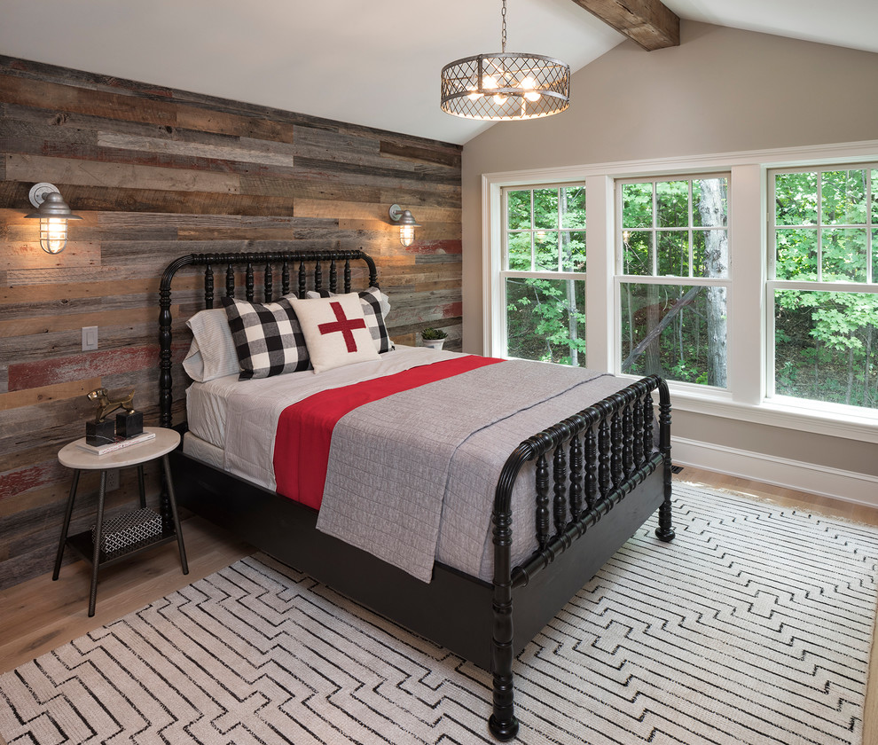 This is an example of a coastal teen’s room in Minneapolis with grey walls and light hardwood flooring.