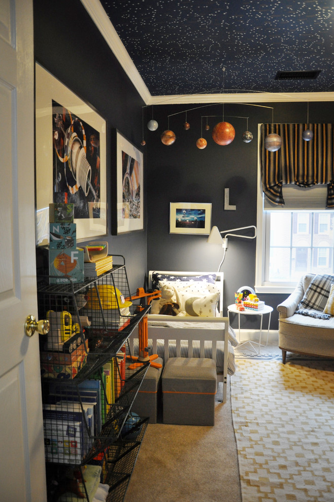 This is an example of a small traditional toddler’s room for boys in DC Metro with blue walls and carpet.