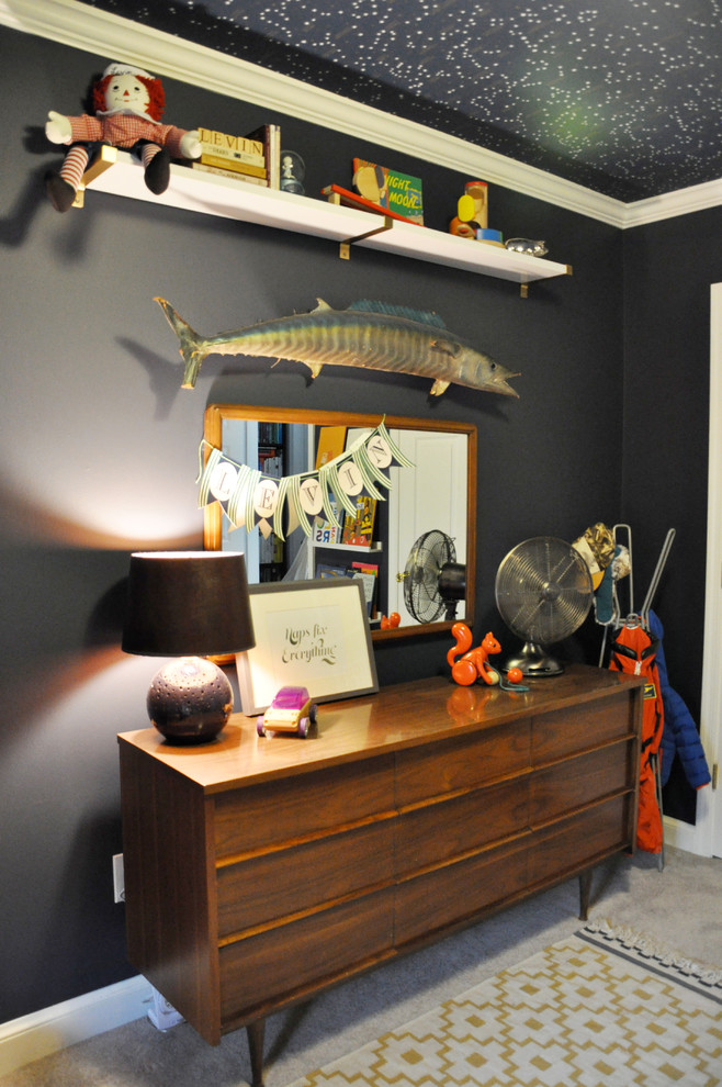 This is an example of a small traditional toddler’s room for boys in DC Metro with blue walls and carpet.