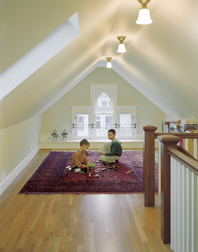 Example of an ornate medium tone wood floor playroom design in Portland with beige walls