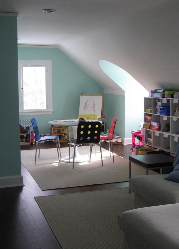Example of a classic dark wood floor kids' room design in New York with blue walls