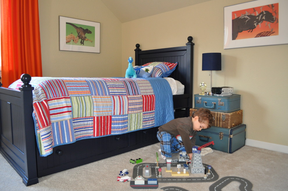 Photo of an eclectic toddler’s room for boys in Portland with beige walls and carpet.