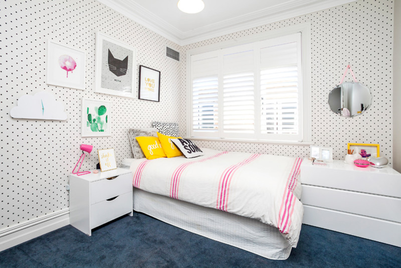 Design ideas for a medium sized contemporary children’s room for girls in Sydney with white walls and carpet.