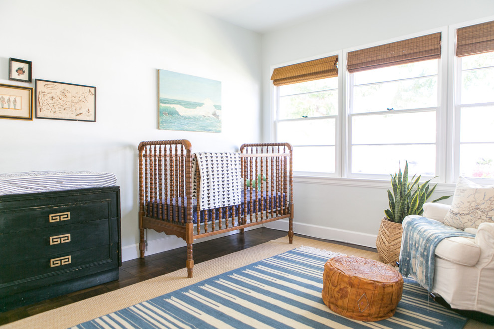Inspiration for a coastal gender-neutral dark wood floor nursery remodel in Los Angeles with white walls