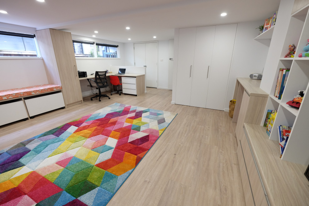 Kids' room - large contemporary vinyl floor kids' room idea in Sydney with white walls