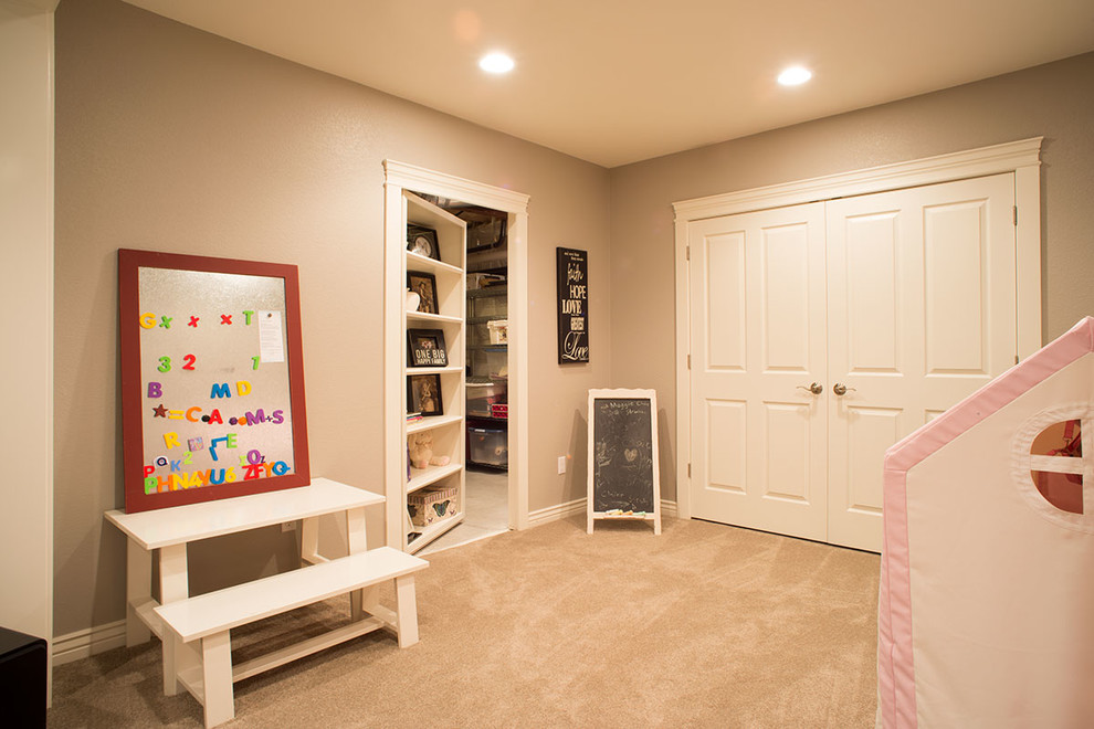 Medium sized classic kids' bedroom for girls in Denver with carpet and grey walls.
