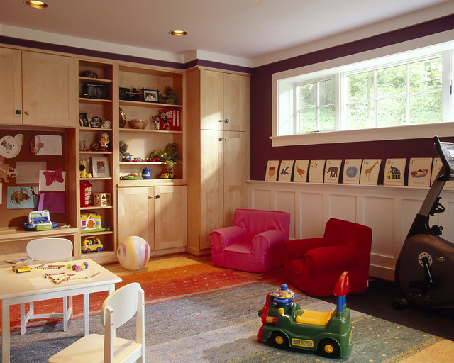 kids basement playroom with builtins, play tables, and small chairs