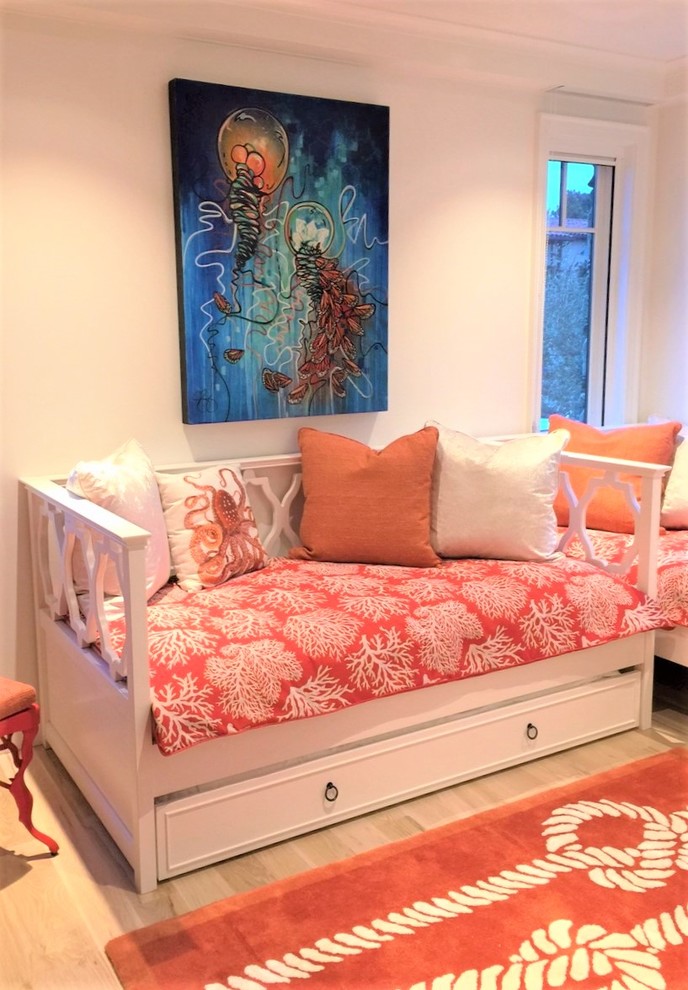 Inspiration for a coastal gender-neutral kids' room remodel in Orange County with white walls
