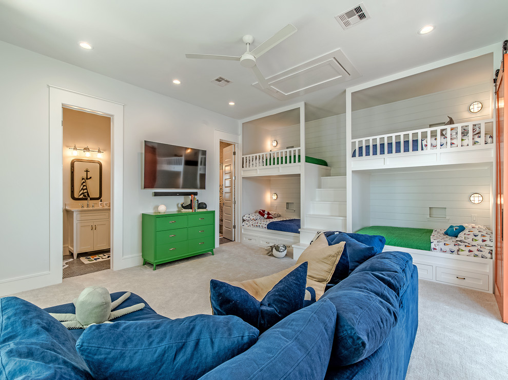 Design ideas for a beach style gender neutral children’s room in Houston with white walls, carpet and beige floors.
