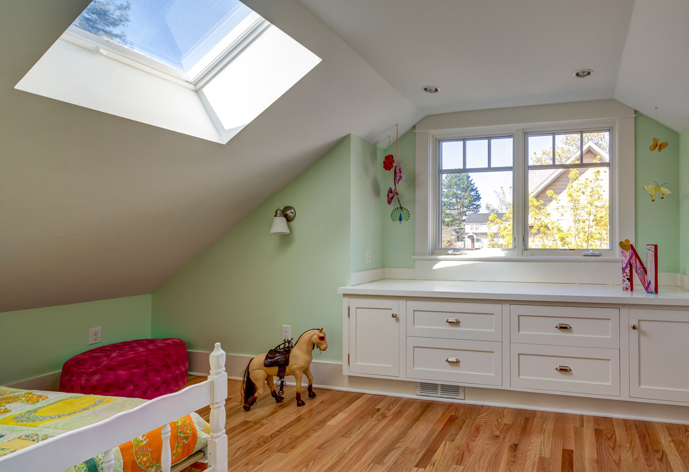 This is an example of a small classic kids' bedroom in Portland with medium hardwood flooring.