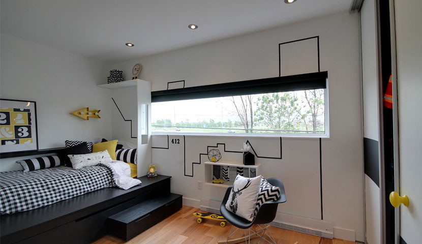 This is an example of a medium sized contemporary children’s room for boys in Montreal with white walls, light hardwood flooring and beige floors.