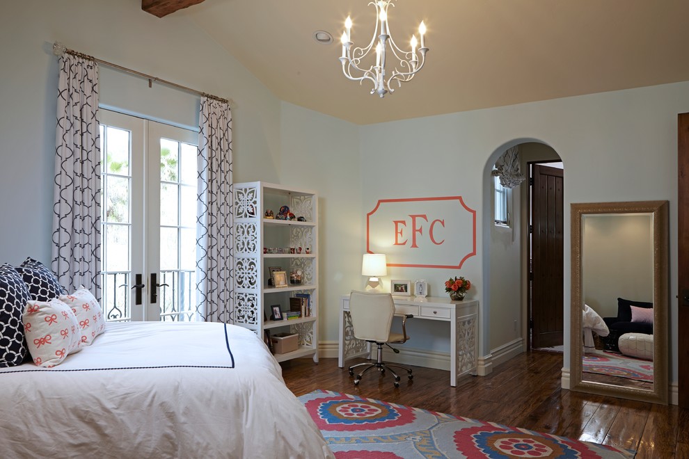 Large classic teen’s room for girls in Los Angeles with blue walls and dark hardwood flooring.