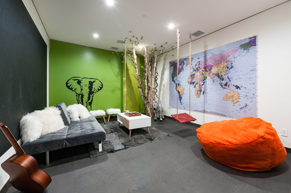Immagine di una cameretta per bambini da 4 a 10 anni design di medie dimensioni con pareti verdi e pavimento grigio
