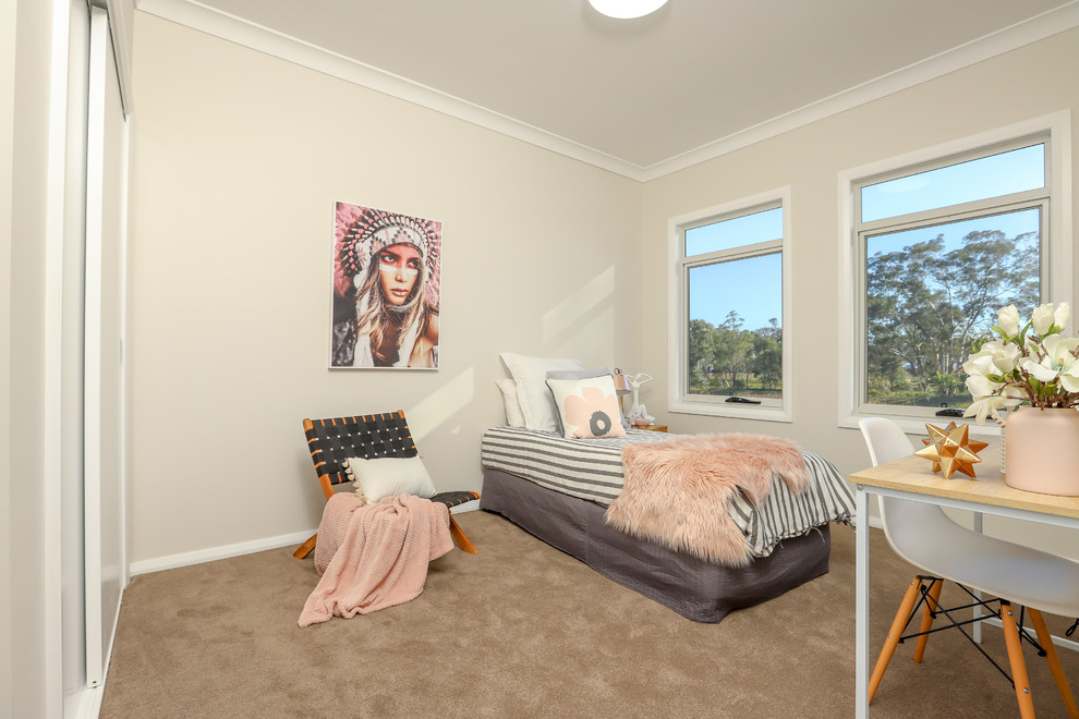 Medium sized contemporary children’s room for girls in Newcastle - Maitland with beige walls, carpet and beige floors.