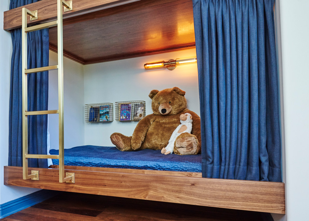 На фото: большая детская в современном стиле с спальным местом, белыми стенами и паркетным полом среднего тона для ребенка от 4 до 10 лет, мальчика