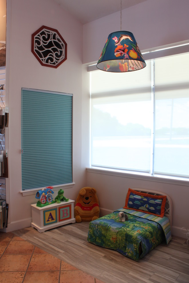 Kids' bedroom in Orlando with porcelain flooring and orange floors.