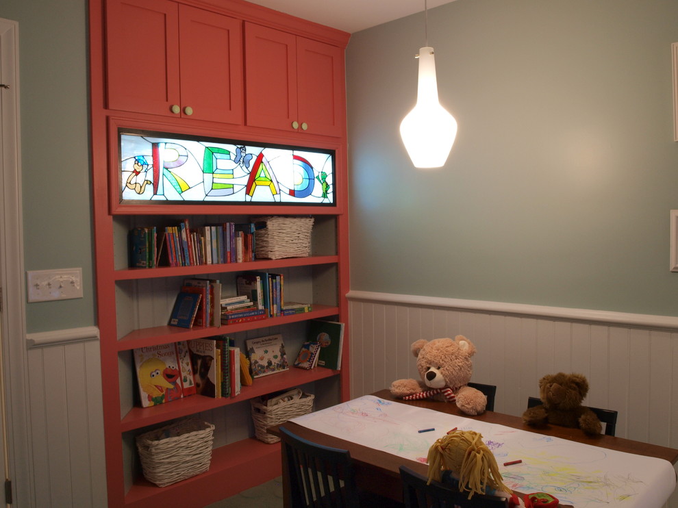 Example of a small transitional gender-neutral carpeted kids' room design in Other with green walls