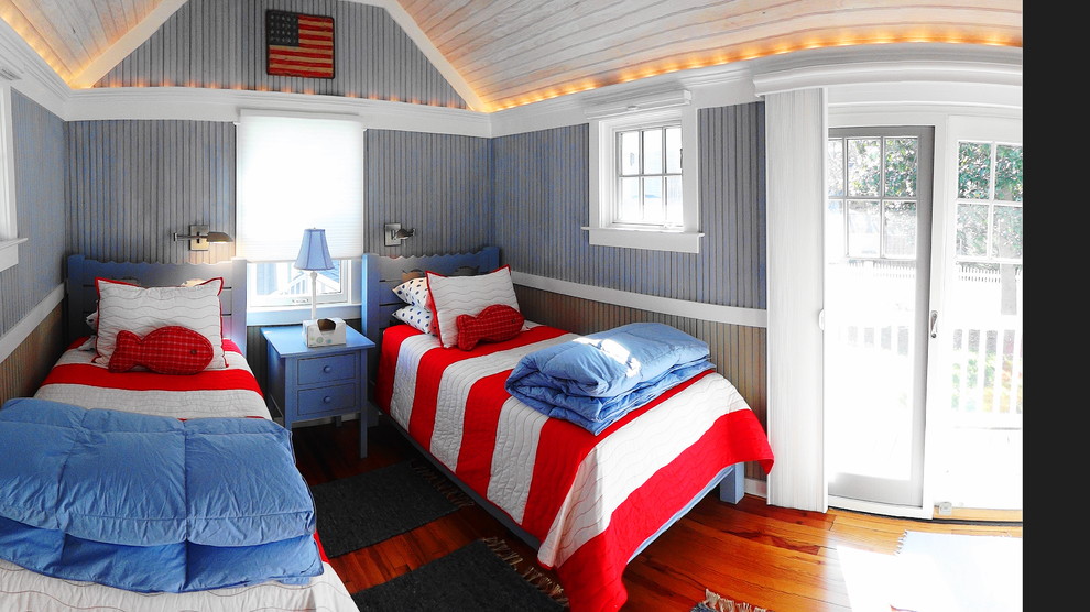 Design ideas for a small nautical gender neutral children’s room in Other with medium hardwood flooring and blue walls.