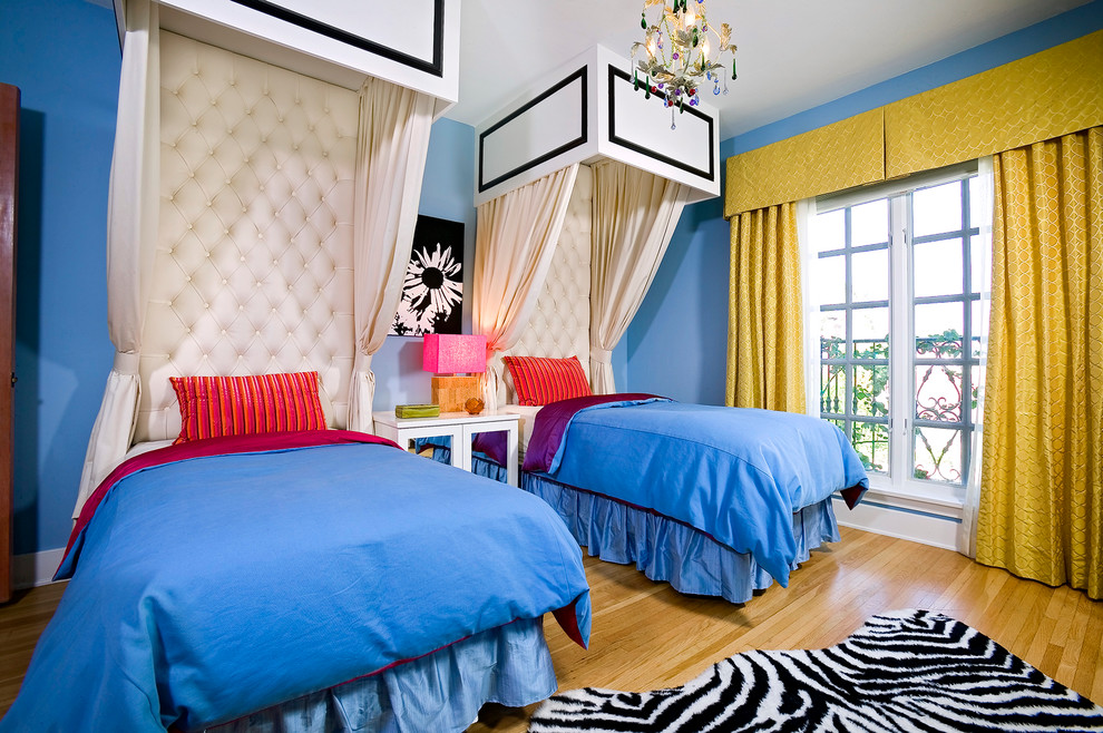 Immagine di una cameretta per bambini design con pareti blu